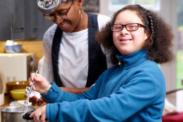 Adult and child baking