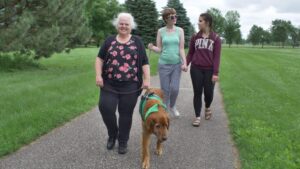 patricia and marco on a walk with a client